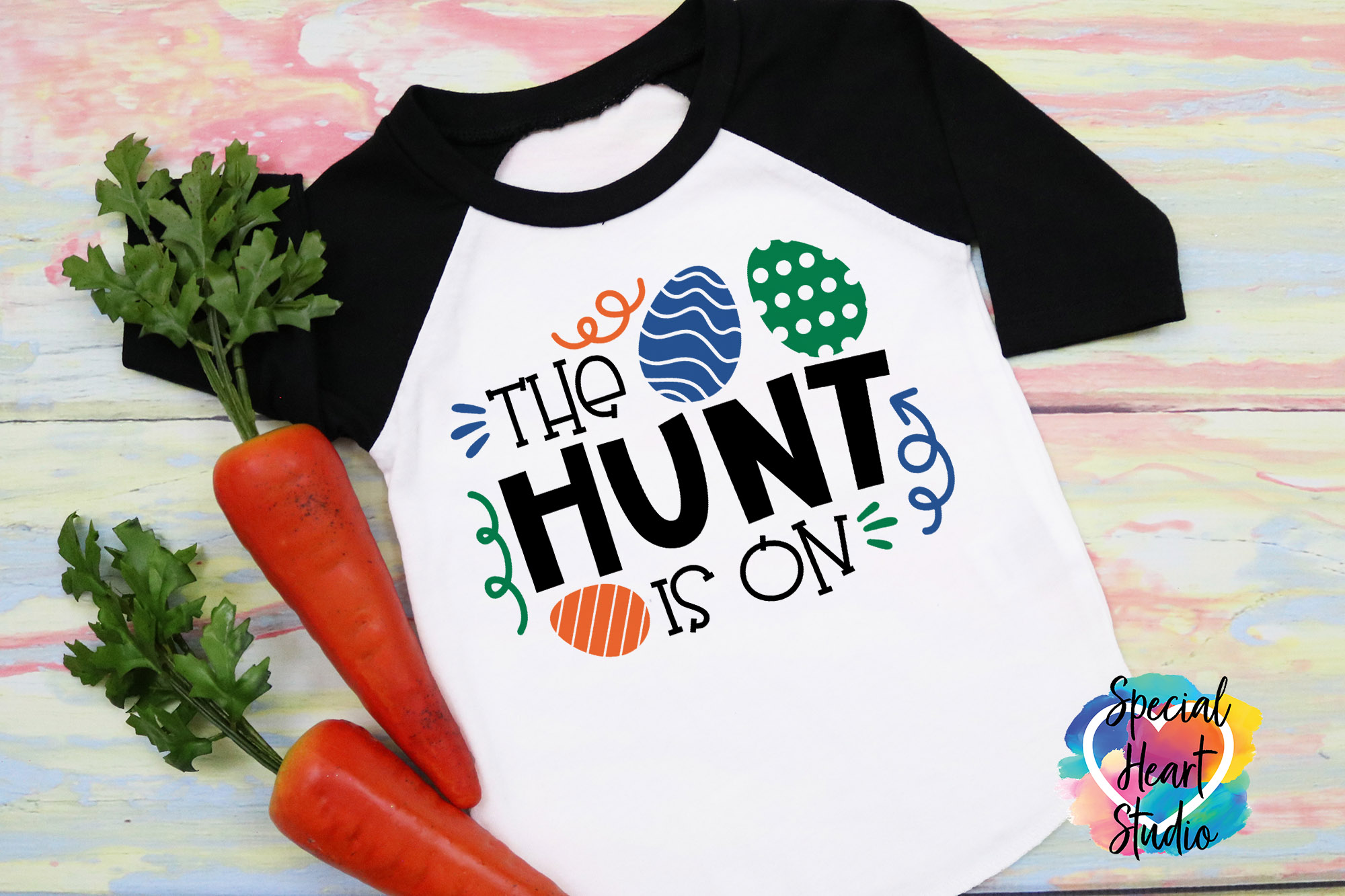 Raglan Shirt saying the hunt is on with easter eggs