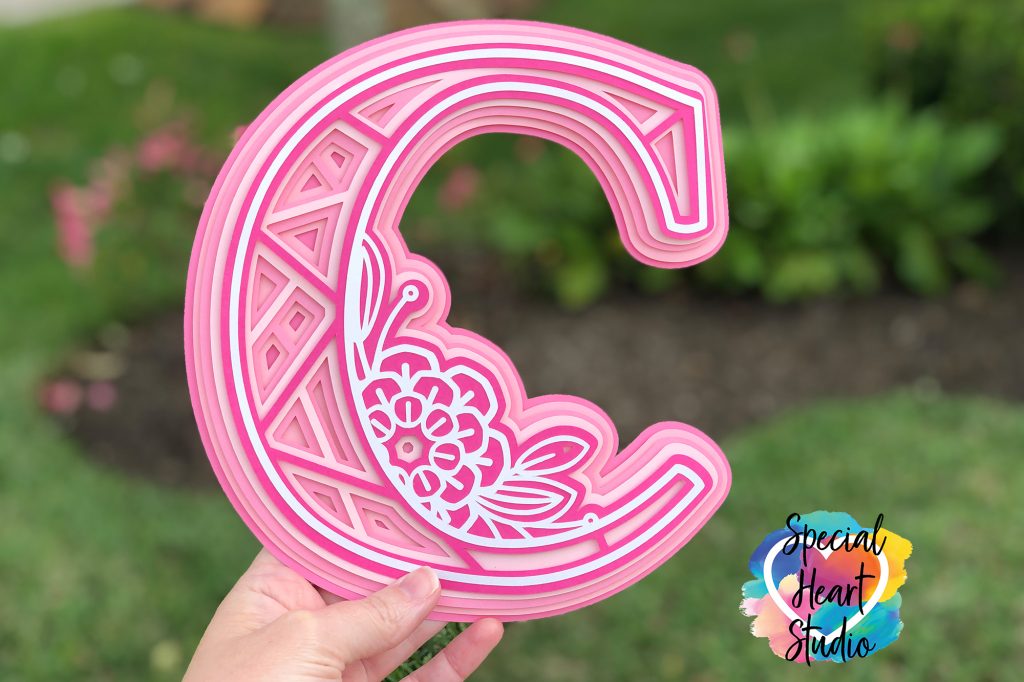 3D layered mandala letter C with floral elements in shades of pink cardstock