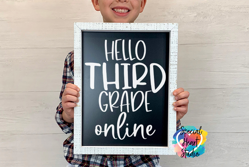 Boy holding chalk board saying Hello Third Grade online