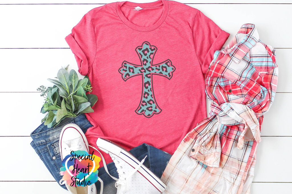 Pink t-shirt with turquoise cross with leopard print spots