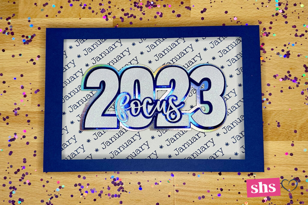 Navy cardstock shadowbox with January 2023 and the word focus over the 2023 numbers.