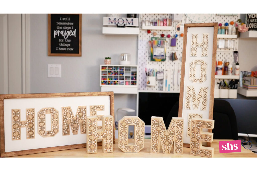 Three wood HOME signs in craft room