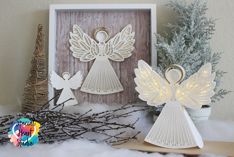 Three White cardstock layered paper angels